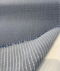 Close view of Sunbrella Lure Denim weave with small light gray dots on denim blue acrylic
