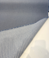 Sunbrella Lure Denim performance fabric showing the scattered organic dot pattern on heathered blue