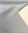 Sunbrella Play Sky fabric folded back to show the selvedge edge and reverse side
