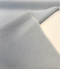 Sunbrella Play Sky fabric folded back to show the selvedge edge and reverse side