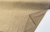 Bronze gold chenille fabric on the roll showing the antique gold and bronze two-tone yarns