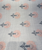 Close view of Sunbrella Mira Sapphire jacquard weave with peach and gray ditsy floral repeat