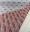 Sunbrella Mira Sapphire floral pattern showing stylized blooms with charcoal stems on light gray