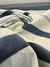 Sunbrella Revival Denim coastal navy stripe performance fabric at the selvedge