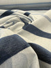 Sunbrella Revival Denim coastal navy stripe performance fabric at the selvedge