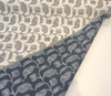 Sunbrella Lola Juniper outdoor botanical fabric showing stylized leaves linked along slender vines