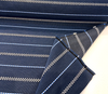 Sunbrella Linger Coast Blue 146762-0007 indigo stripe fabric on the roll