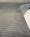 Dark teal diamond lattice fabric with sand, gray and black woven dots