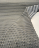 Dark teal diamond lattice fabric with sand, gray and black woven dots