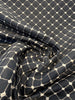 Knit-backed black and ivory honeycomb diamond upholstery fabric