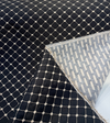 Close-up of the woven knots at each intersection of the ivory grid