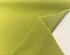 Close-up of the tight canvas-like weave in citrus green and yellow