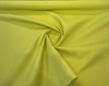 Brightside Citrus chartreuse fabric at the yellow selvedge edge