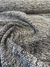 Siesta Tweed Onyx textured charcoal chenille fabric on the roll