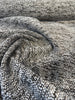 Siesta Tweed Onyx textured charcoal chenille fabric on the roll