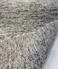 Salt-and-pepper chenille tweed reading as charcoal gray from a distance