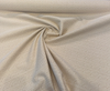 Sunbrella Posh Oat woven herringbone texture close-up in tan and ivory