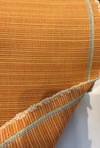 Sunbrella Dupione Tangerine burnt orange slubbed silk look fabric on the roll