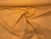 Sunbrella Dupione Tangerine railroaded stripe running across the roll