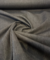 Sunbrella Hint Coal dark gray outdoor patio cushion fabric showing lighter reverse