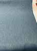 Sunbrella Hint Lagoon denim look performance fabric on the roll