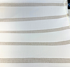 Sunbrella Mixi Linen beige and white stripe fabric on the roll