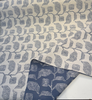 Lola Slate spiral diamond pod motifs in steel blue on warm ivory ground