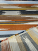 Sunbrella Transformation Canyon terracotta rust golden yellow charcoal stripe on the roll