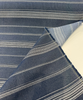 Sunbrella Toro Indigo stripe fabric showing lighter chambray blue reverse detail