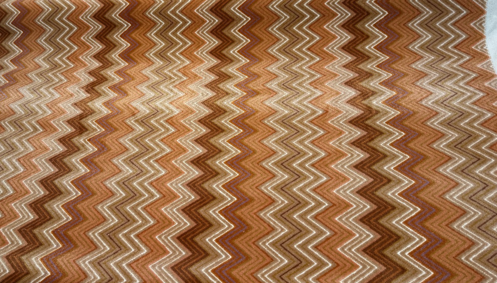 Opuzen Juno Canyon zigzag chevron velvet upholstery fabric in rust, burnt orange, brown and cream