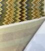 Opuzen Juno Country Gold flame stitch velvet, close-up of the gold and teal zigzag bands