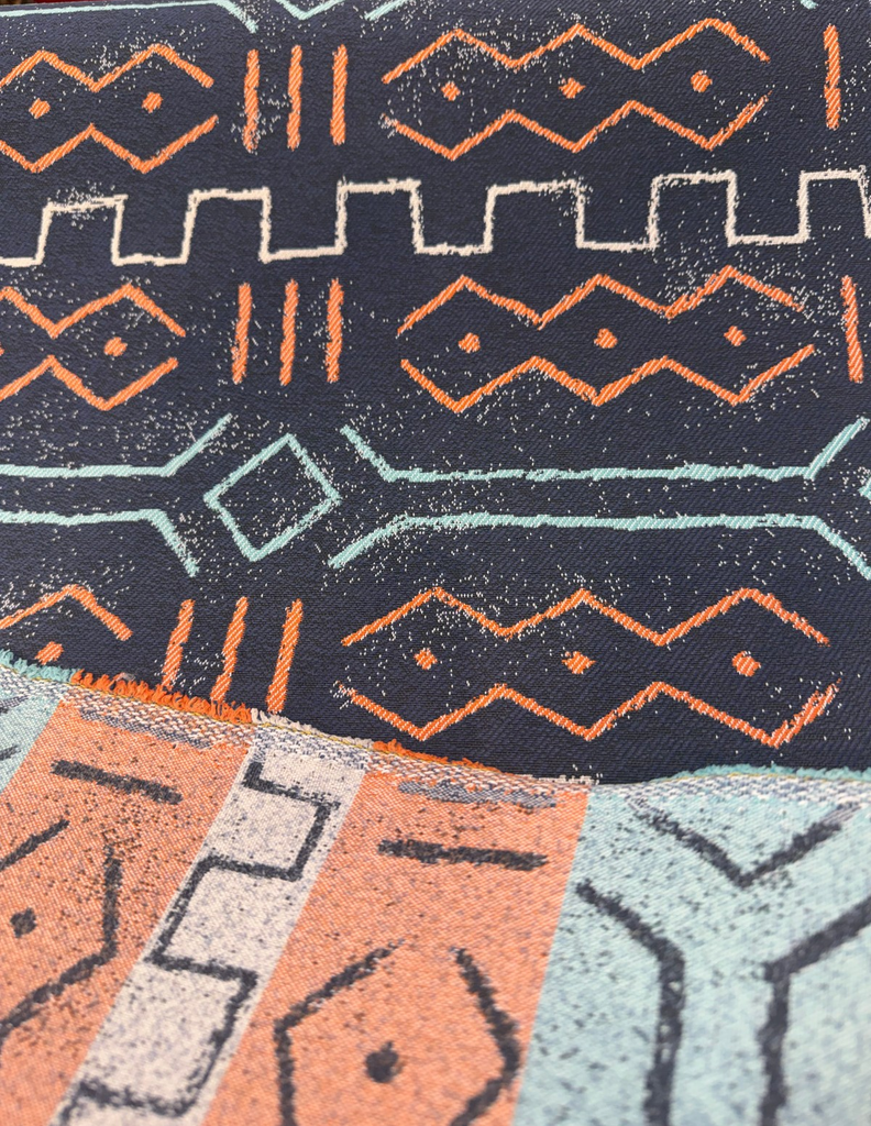 Revolution Prescott Navy mud cloth indoor outdoor fabric with coral zigzag diamonds, aqua branches and gray meander