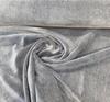 Denim blue mohair velvet on the bolt showing face and backing at the selvage