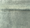 Jackpot Green mohair upholstery velvet on the cutting table showing the heathered pile