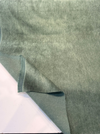 Fabricut Jackpot Green mohair velvet laid flat, showing the silvery sheen of the sage pile