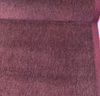 Fabricut mohair velvet in heathered Raspberry on the bolt with the selvage edge