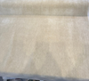 Fabricut mohair velvet in Blond Beige on the bolt showing the selvage edge