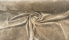 Camel tan mohair velvet with the cream backing folded back at the selvage