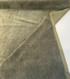Green Commander olive mohair upholstery velvet unrolled on the cutting table