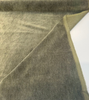 Green Commander olive mohair upholstery velvet unrolled on the cutting table