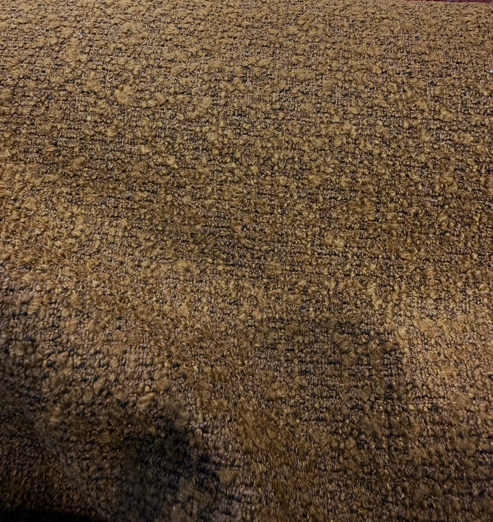 Heavy bouclé in Bark Brown draped in a swirl to show the nubby textured weave