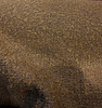 Heavy bouclé in Bark Brown draped in a swirl to show the nubby textured weave