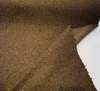 Close-up of Bark Brown bouclé showing the looped olive-brown yarns and charcoal flecks
