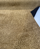 Dominator Bouclé Nougat laid flat showing the mottled honey and olive-bronze texture