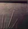 Crypton Sintra Mink brown performance velvet on the roll across the cutting table