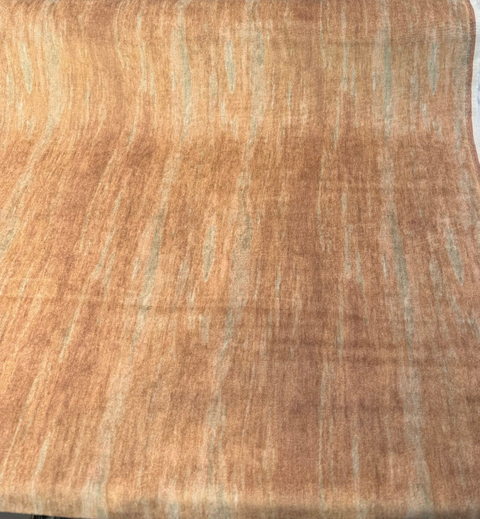 Mirage Venus salmon mohair velvet in an abstract strié, folded back to show the cream backing