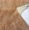 Mirage Venus salmon mohair velvet rolled back to show the streaked pile and cream backing