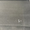Water drops beading up on a roll of slate gray Crypton performance velvet