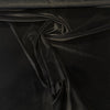 Close-up swirl of black Crypton performance velvet on the roll