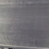 Charcoal gray Crypton Sintra Shark velvet upholstery fabric laid flat on the roll